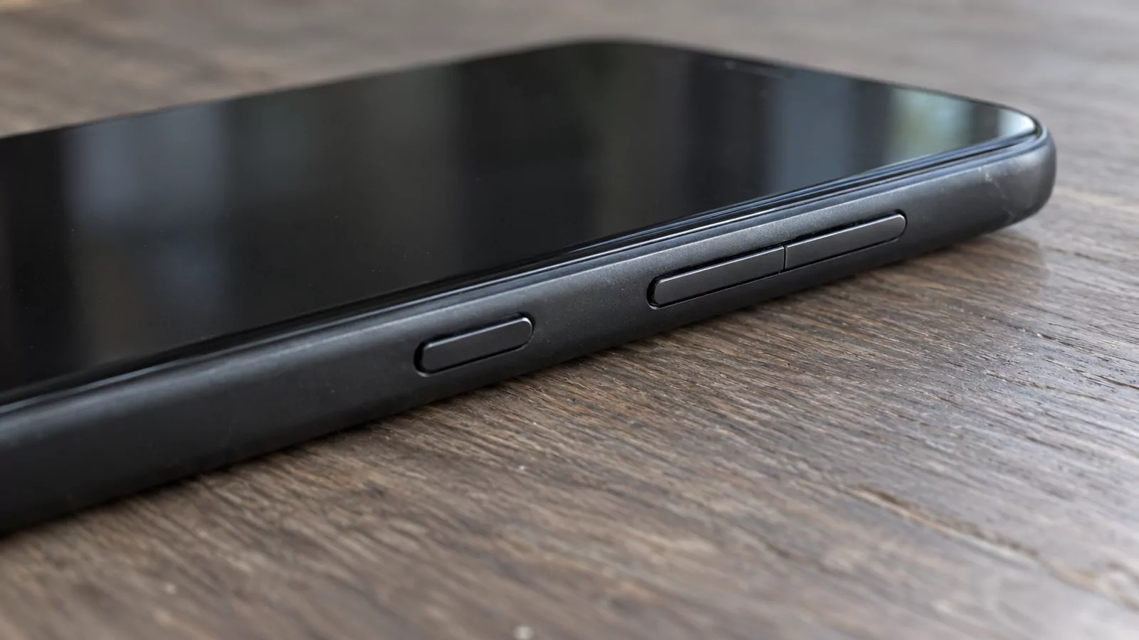 Close-up illustration of a phone's volume rocker and separate side button